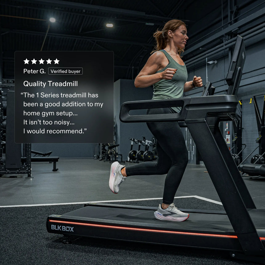 Athlete running on the BLK BOX 1 Series Treadmill with a 5-star verified review from Peter G.: “The 1 Series treadmill has been a good addition to my home gym setup… It isn’t too noisy… I would recommend.”
