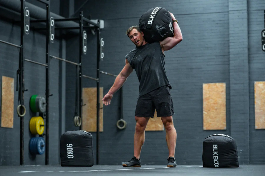 From Carries to Cleans: Unlocking the Power of the Strongman Sandbag-BLK BOX