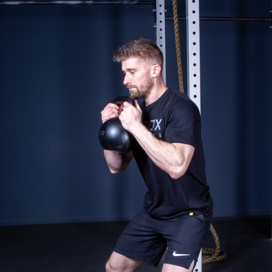 utility cast iron kettlebell in use 